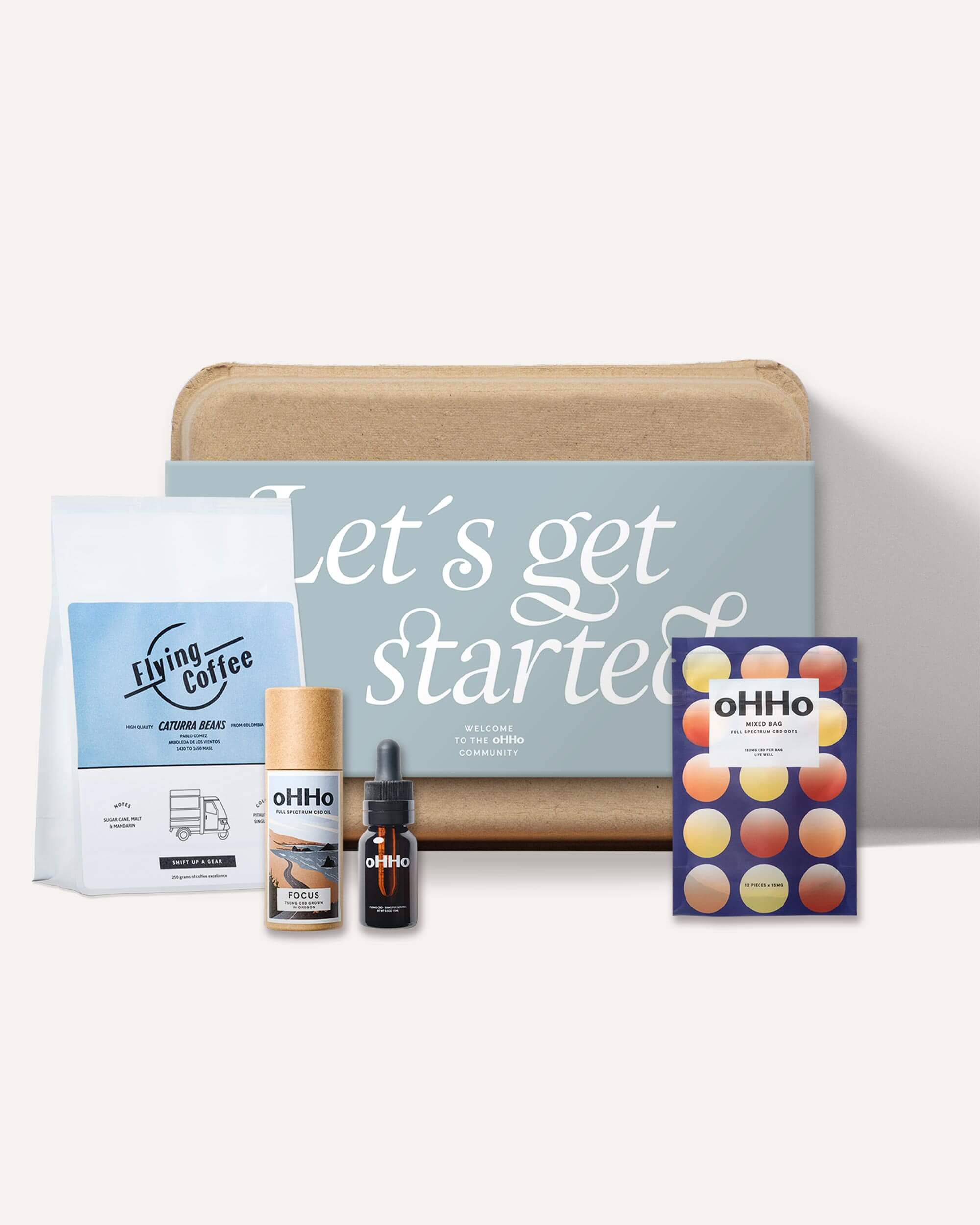 Three products that come in a pack together. Mixed pouch of dots, Focus Oil and a bag of coffee beans all in blue packaging