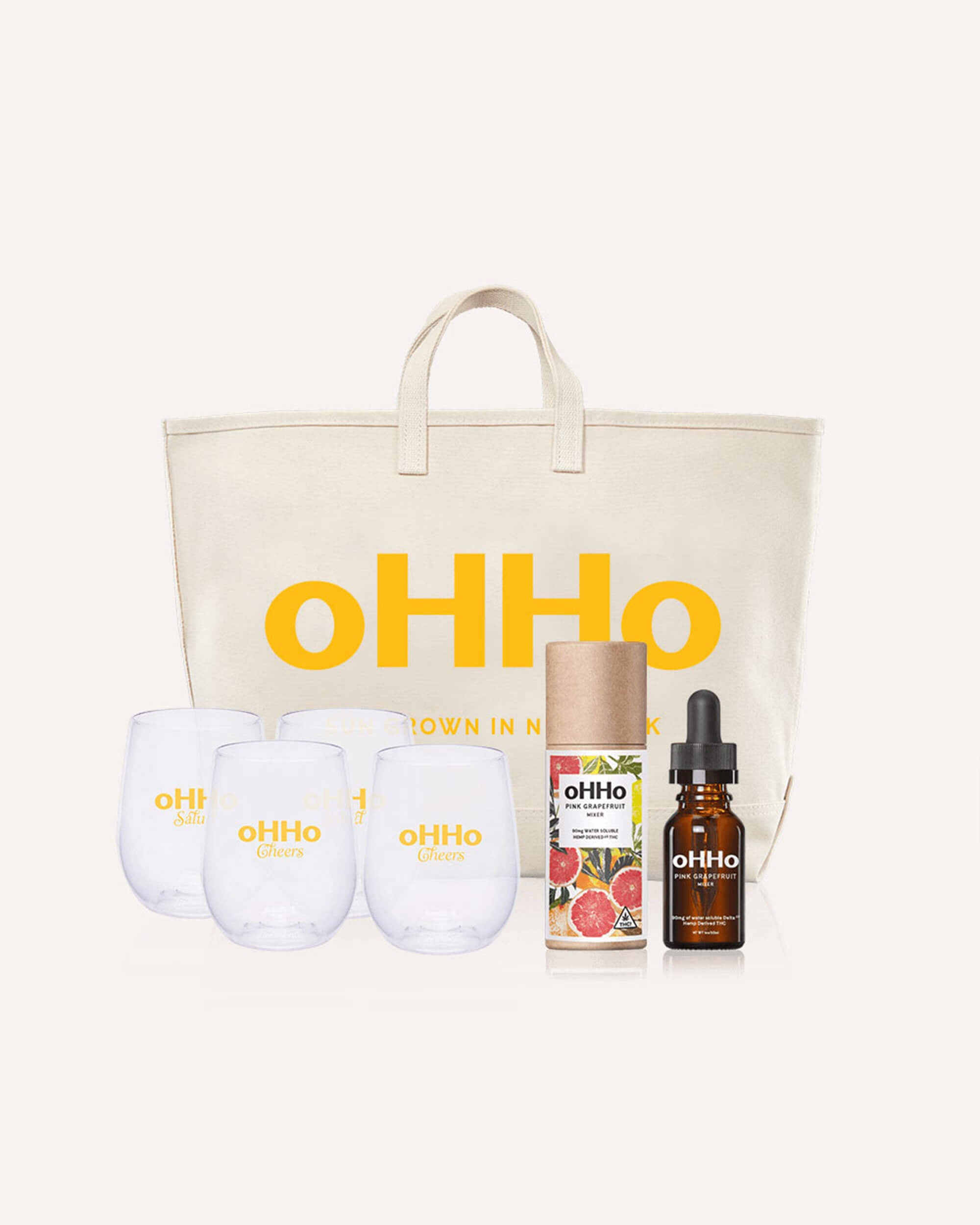 A pack with a tote, four glasses and a pink grapefruit mixer - perfect for the hostess