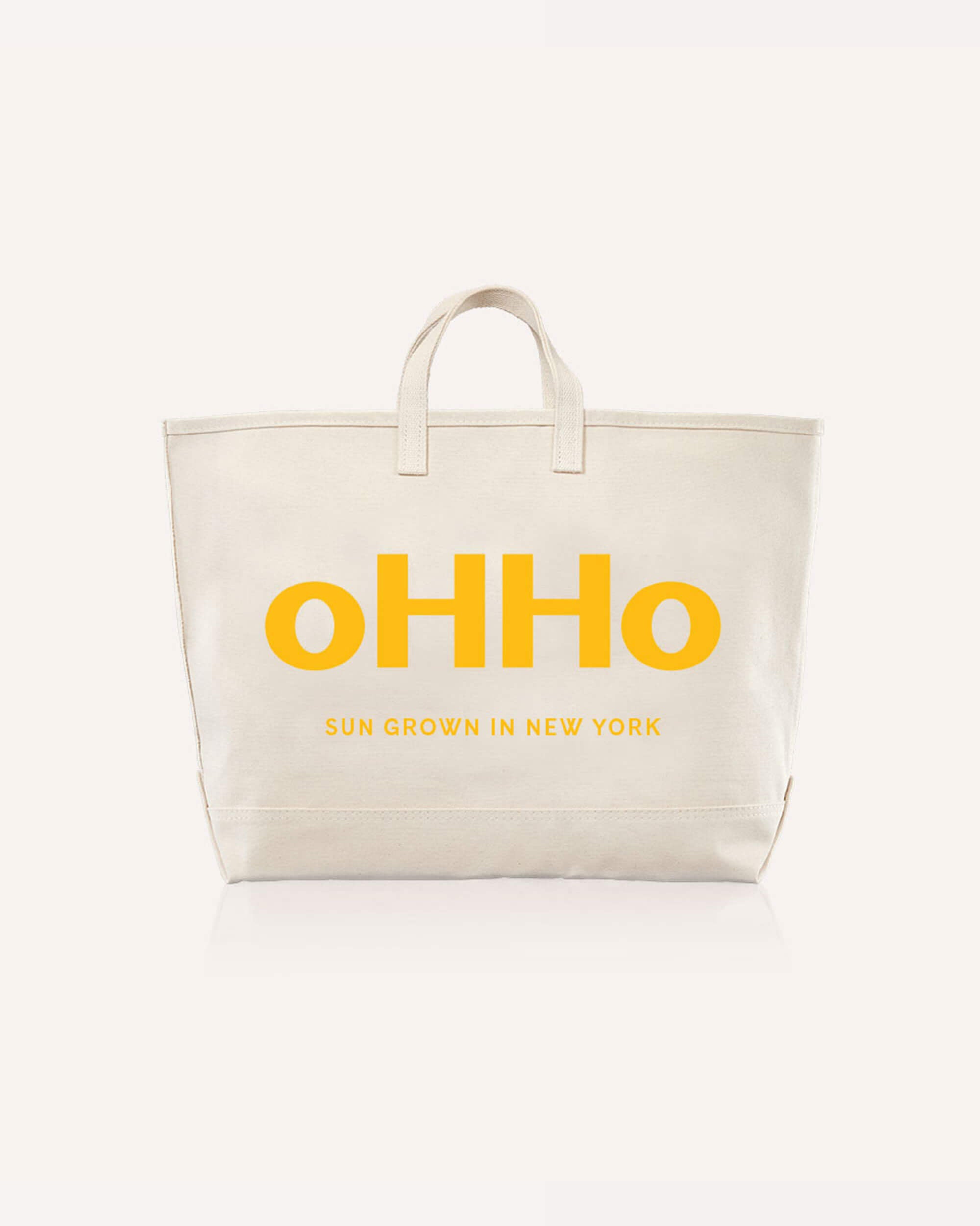 A canvas tote bag with oHHo logo on it in yellow